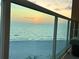 Balcony view of the sunset and tranquil ocean at 880 Mandalay Ave # N607, Clearwater Beach, FL 33767