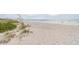 Expansive white sand beach with clear ocean waters, perfect for relaxation and beachcombing at 880 Mandalay Ave # N607, Clearwater Beach, FL 33767