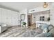 Open-concept living area with ocean views, white built-ins, and wood floors at 880 Mandalay Ave # N607, Clearwater Beach, FL 33767