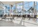 Bright, expansive lobby features floor-to-ceiling windows with stunning views of palm trees and the ocean at 880 Mandalay Ave # N607, Clearwater Beach, FL 33767