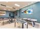 Large recreation room features ping pong, pool table, foosball, and views of the ocean at 880 Mandalay Ave # N607, Clearwater Beach, FL 33767