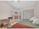 Bedroom with a desk, bay windows, laminate floors, ceiling fan, and closet space at 9466 Forest Hills Cir, Tampa, FL 33612
