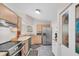 Well-lit kitchen with stainless steel appliances and wooden cabinets at 9466 Forest Hills Cir, Tampa, FL 33612