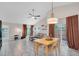 Large living room with tile floors, vaulted ceiling, and dining area at 9466 Forest Hills Cir, Tampa, FL 33612