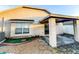 Covered back patio, gravel, and sliding glass doors to the backyard at 9735 Riverchase Dr, New Port Richey, FL 34655