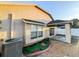 Covered back patio, gravel, and sliding glass doors to the backyard at 9735 Riverchase Dr, New Port Richey, FL 34655
