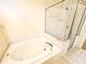 Bathroom featuring soaking tub, separate shower, and tile floors at 9735 Riverchase Dr, New Port Richey, FL 34655