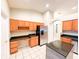 Well-equipped kitchen featuring a kitchen island and stainless steel appliances at 9735 Riverchase Dr, New Port Richey, FL 34655