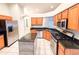 Open concept kitchen with granite countertops and stainless steel appliances at 9735 Riverchase Dr, New Port Richey, FL 34655
