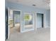 Bedroom with a mirror and doors to a hallway and a closet at 10205 Deercliff Dr, Tampa, FL 33647