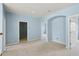 Carpeted bedroom with multiple interior doors at 10205 Deercliff Dr, Tampa, FL 33647