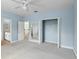 Bedroom with double closets and doors to a bathroom and a hallway at 10205 Deercliff Dr, Tampa, FL 33647