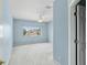 Light filled bedroom with ceiling fan and a large window overlooking the front yard at 10205 Deercliff Dr, Tampa, FL 33647