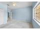 Comfortable bedroom featuring a window with a view and ample closet space at 10205 Deercliff Dr, Tampa, FL 33647