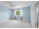 Bedroom featuring carpeted floor, ceiling fan, light, and natural light at 10205 Deercliff Dr, Tampa, FL 33647