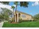 Two-story home featuring manicured landscaping, mature trees, and an inviting exterior at 10205 Deercliff Dr, Tampa, FL 33647