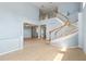 Expansive foyer with curved staircase and balcony at 10205 Deercliff Dr, Tampa, FL 33647