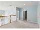 Spacious hallway featuring carpeted floors and multiple doorways at 10205 Deercliff Dr, Tampa, FL 33647