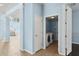 Bright laundry room with tile floors, washer, and dryer, accessible through an open door at 10205 Deercliff Dr, Tampa, FL 33647