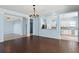Bright and airy living room showcasing hardwood floors, neutral walls, and an open concept layout at 10205 Deercliff Dr, Tampa, FL 33647