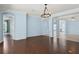 Spacious living room featuring hardwood floors, recessed lighting, and views to a second-floor foyer at 10205 Deercliff Dr, Tampa, FL 33647