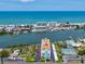 Overhead shot of a condominium with water views, tennis courts, and ample parking at 10216 Regal Dr # 409, Largo, FL 33774