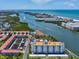Stunning aerial view of a condominium complex nestled along a scenic waterway near the ocean at 10216 Regal Dr # 409, Largo, FL 33774