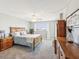 Bedroom offering a decorative ceiling fan, light colored walls and neutral colored carpet at 10216 Regal Dr # 409, Largo, FL 33774