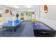Entertaining game room featuring ping pong and air hockey, perfect for leisure and fun at 10216 Regal Dr # 409, Largo, FL 33774