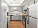 Functional kitchen with ample storage and stainless steel appliances at 10216 Regal Dr # 409, Largo, FL 33774