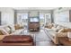Cozy living room with access to a private balcony at 10216 Regal Dr # 409, Largo, FL 33774