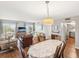 Open-concept living and dining area with hardwood floors at 10216 Regal Dr # 409, Largo, FL 33774