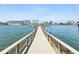 Scenic pier view showcases waterfront living and skyline views, inviting relaxation by the water at 10216 Regal Dr # 409, Largo, FL 33774