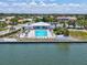 Aerial view of the community pool and clubhouse, a perfect blend of leisure and recreation at 10216 Regal Dr # 409, Largo, FL 33774