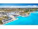 Stunning aerial view of the community lagoon with beach, cabanas, restaurant and playground at 11291 Cay Spruce Way, San Antonio, FL 33576