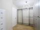 Organized walk-in closet with built-in shelving and ample storage space, complemented by a chandelier at 11291 Cay Spruce Way, San Antonio, FL 33576