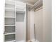A walk-in closet with custom shelving, offering ample storage space and organization at 11291 Cay Spruce Way, San Antonio, FL 33576