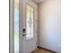 Entryway featuring a white door with decorative glass and stylish hardware at 11291 Cay Spruce Way, San Antonio, FL 33576