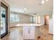 Kitchen island with bar seating opens to the dining area with windows and backyard views at 11291 Cay Spruce Way, San Antonio, FL 33576
