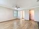 Open living room with hardwood floors, shuttered windows, and neutral paint at 11291 Cay Spruce Way, San Antonio, FL 33576