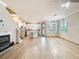 Open-concept living area featuring wood floors, lots of natural light and easy access to the kitchen at 11291 Cay Spruce Way, San Antonio, FL 33576