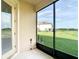 Relaxing screened patio provides an indoor/outdoor living space with views of the lush green backyard at 11291 Cay Spruce Way, San Antonio, FL 33576