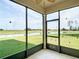 Relaxing screened porch with views of the backyard and pond at 11291 Cay Spruce Way, San Antonio, FL 33576