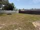 Fenced backyard features a fire pit, offering privacy and space for outdoor activities and relaxation at 11807 Addison St, Spring Hill, FL 34609