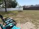 Large backyard with a fire pit and chairs, perfect for outdoor gatherings and relaxation at 11807 Addison St, Spring Hill, FL 34609