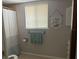 Cozy bathroom with shower, neutral color scheme, and practical fixtures at 11807 Addison St, Spring Hill, FL 34609