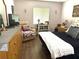 Comfortable bedroom features a bed with a black comforter and wooden furnishings at 11807 Addison St, Spring Hill, FL 34609