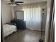 Cozy bedroom with hardwood floors, and window with lots of natural light at 11807 Addison St, Spring Hill, FL 34609