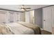 Bedroom featuring bright natural light, wood floors, walk in closet and access to a bathroom at 12516 Cobble Stone Dr, Hudson, FL 34667