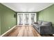 Versatile room with hardwood floors, sofa, and french doors. Perfect for relaxing or entertaining guests at 12516 Cobble Stone Dr, Hudson, FL 34667